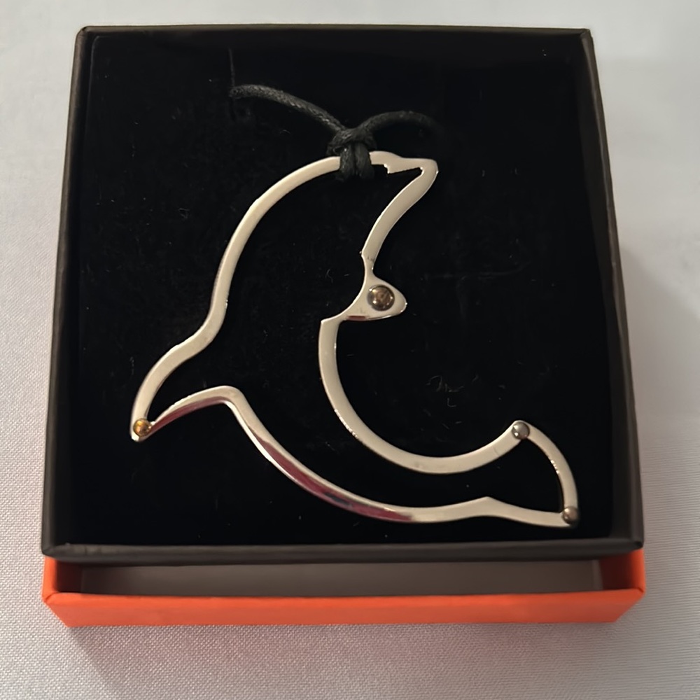 Necklace adjustable with silver plated dolphin pendant. New never worn